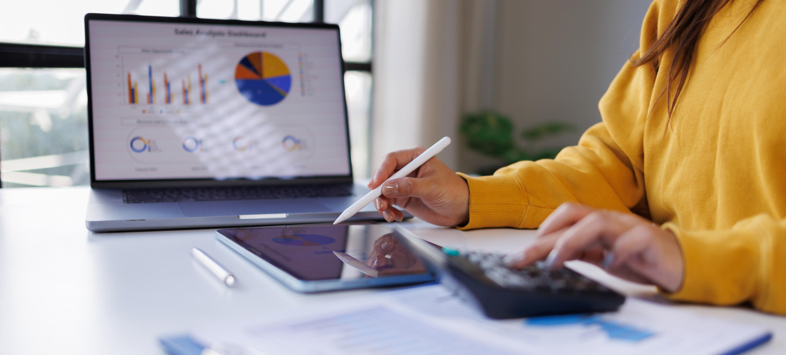 Businesswoman working and calculating on digital financial
